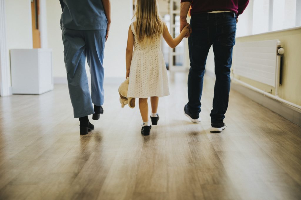 Daughter walking with her disabled father